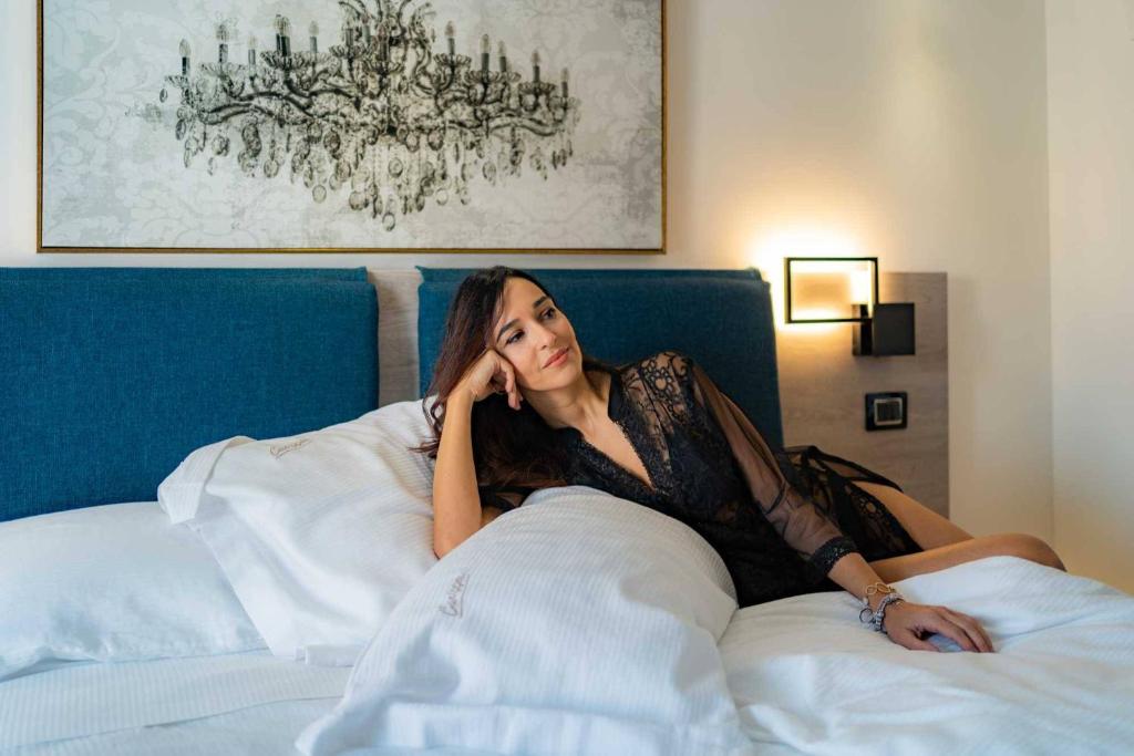 Postel nebo postele na pokoji v ubytování Carizza Rooms