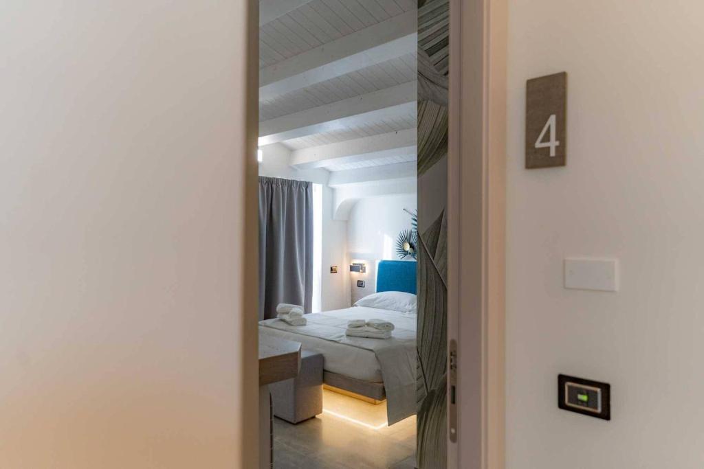 Postel nebo postele na pokoji v ubytování Carizza Rooms