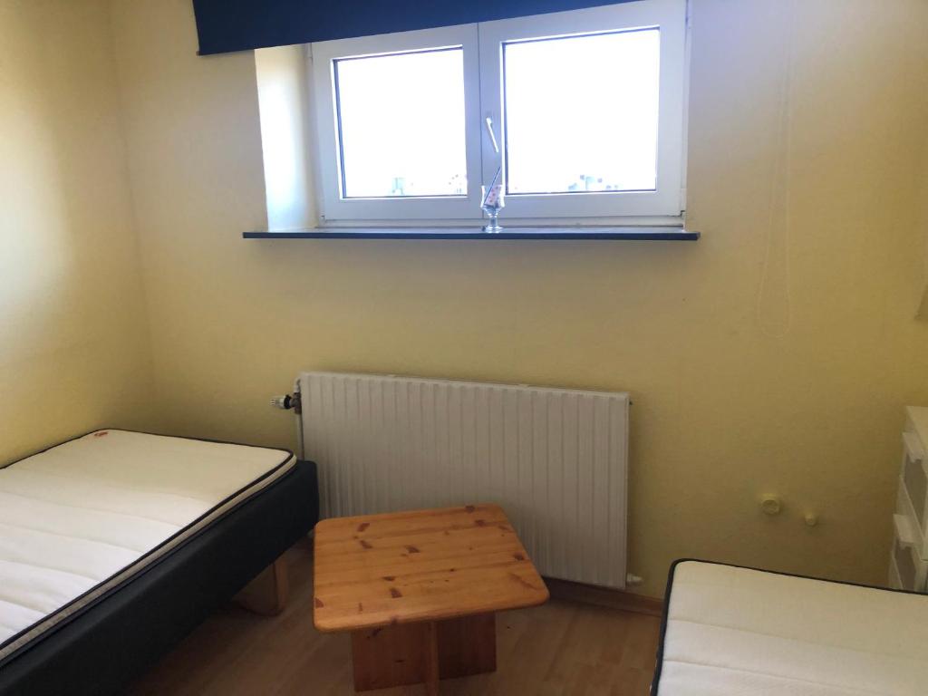 Postel nebo postele na pokoji v ubytování Pinnebergheim