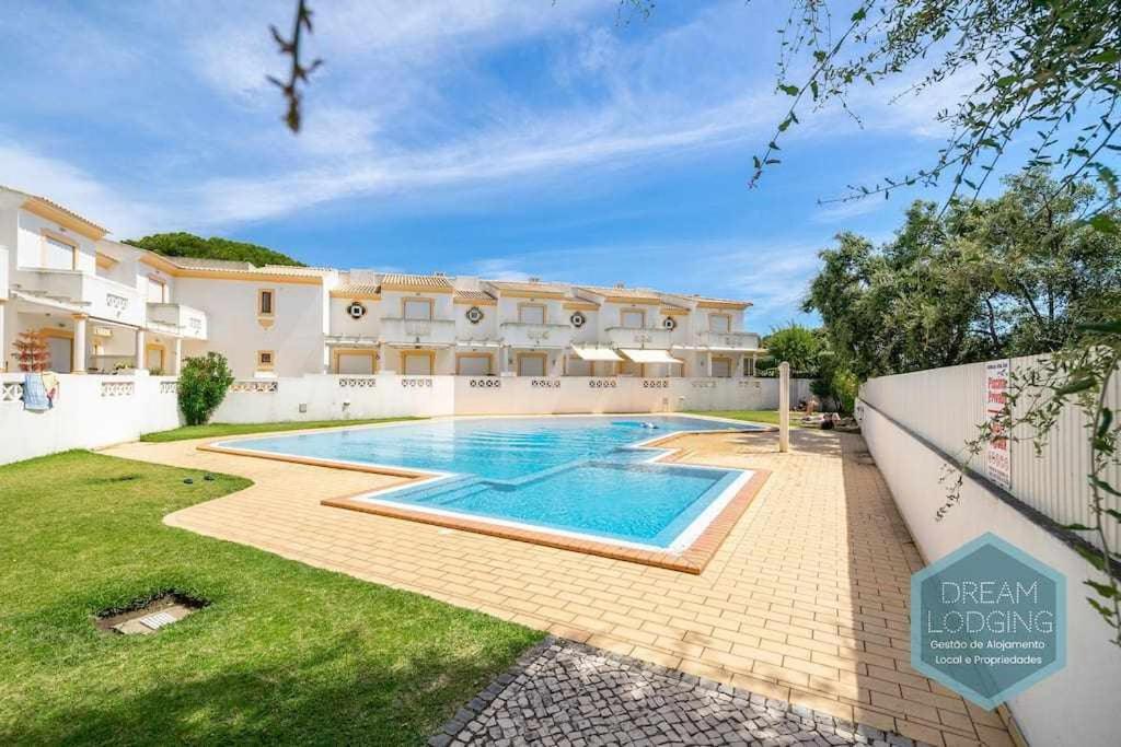 a swimming pool in the backyard of a house at Vila Sul Dream Lodging in Albufeira