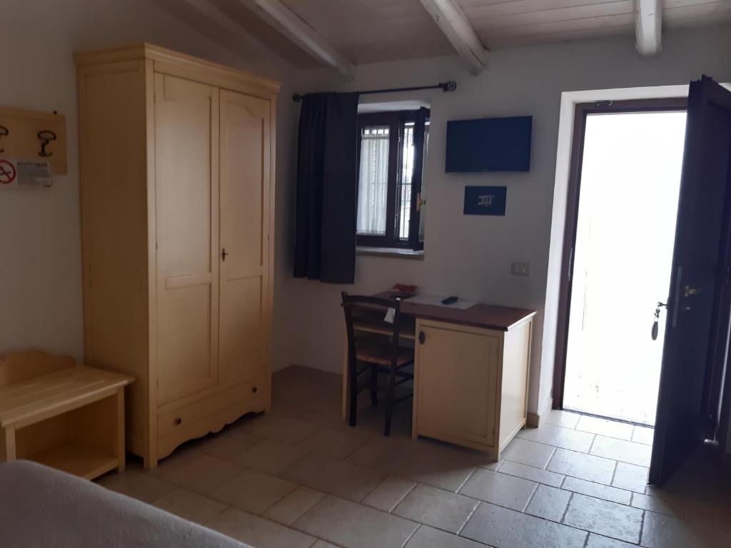 Postel nebo postele na pokoji v ubytování B&B Il Mulino del Monastero