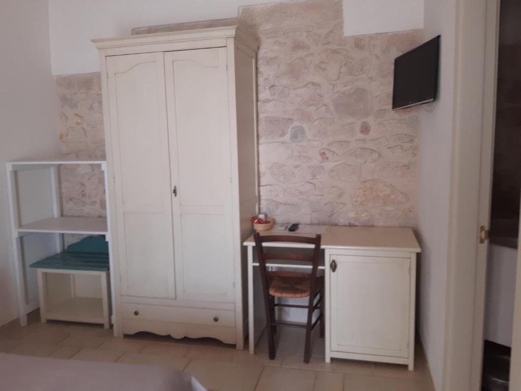 Postel nebo postele na pokoji v ubytování B&B Il Mulino del Monastero