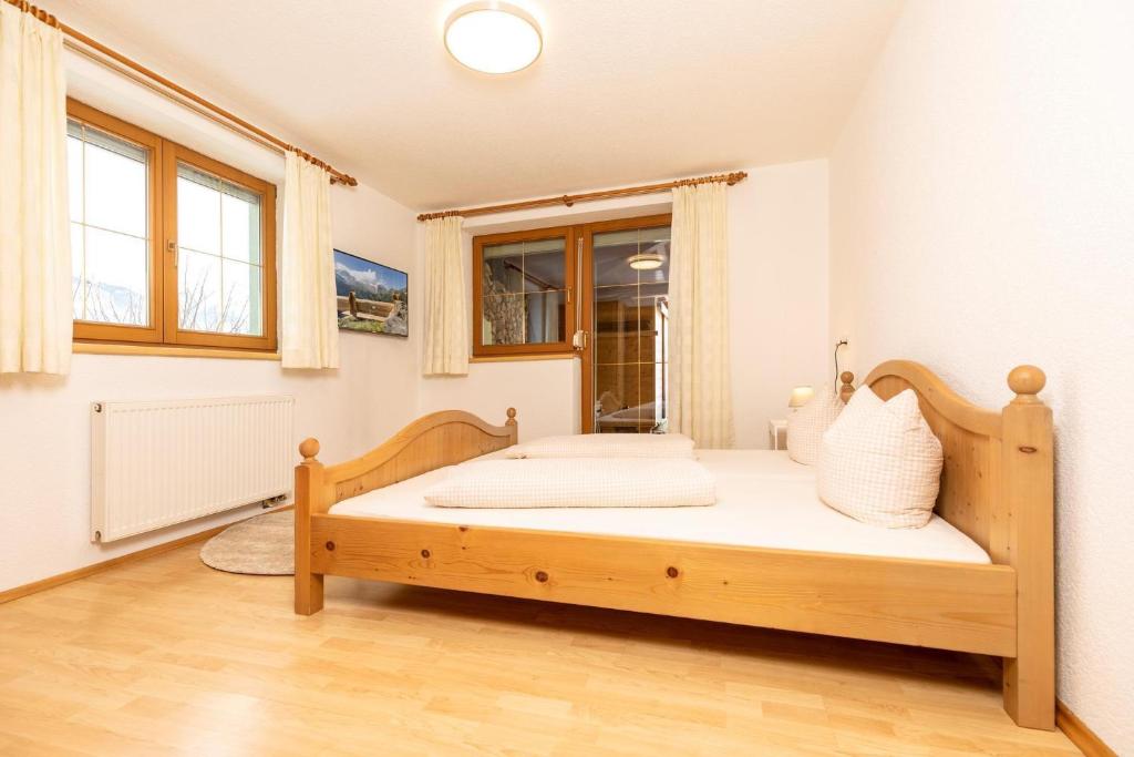 Posteľ alebo postele v izbe v ubytovaní holiday home, Strass im Zillertal