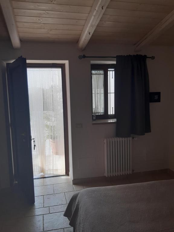 Postel nebo postele na pokoji v ubytování B&B Il Mulino del Monastero