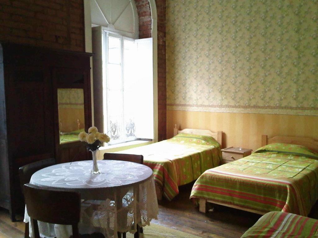 Postel nebo postele na pokoji v ubytování Hotel Garden