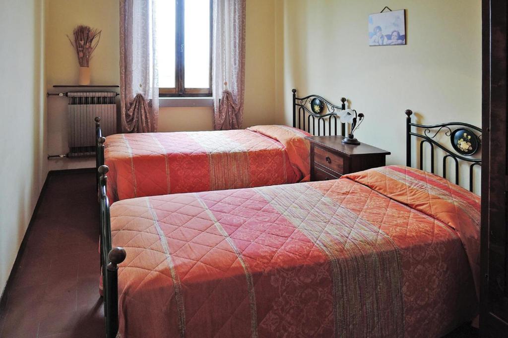 A bed or beds in a room at Villa in Montaione with Pool & Wine Tasting