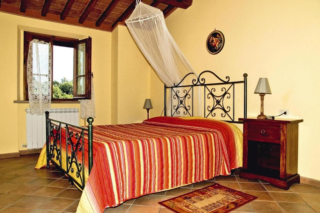 A bed or beds in a room at Villa in Montaione with Pool & Wine Tasting