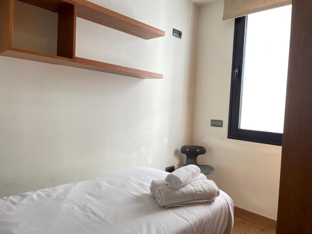 A bed or beds in a room at Gav Espinel Ronda Centro