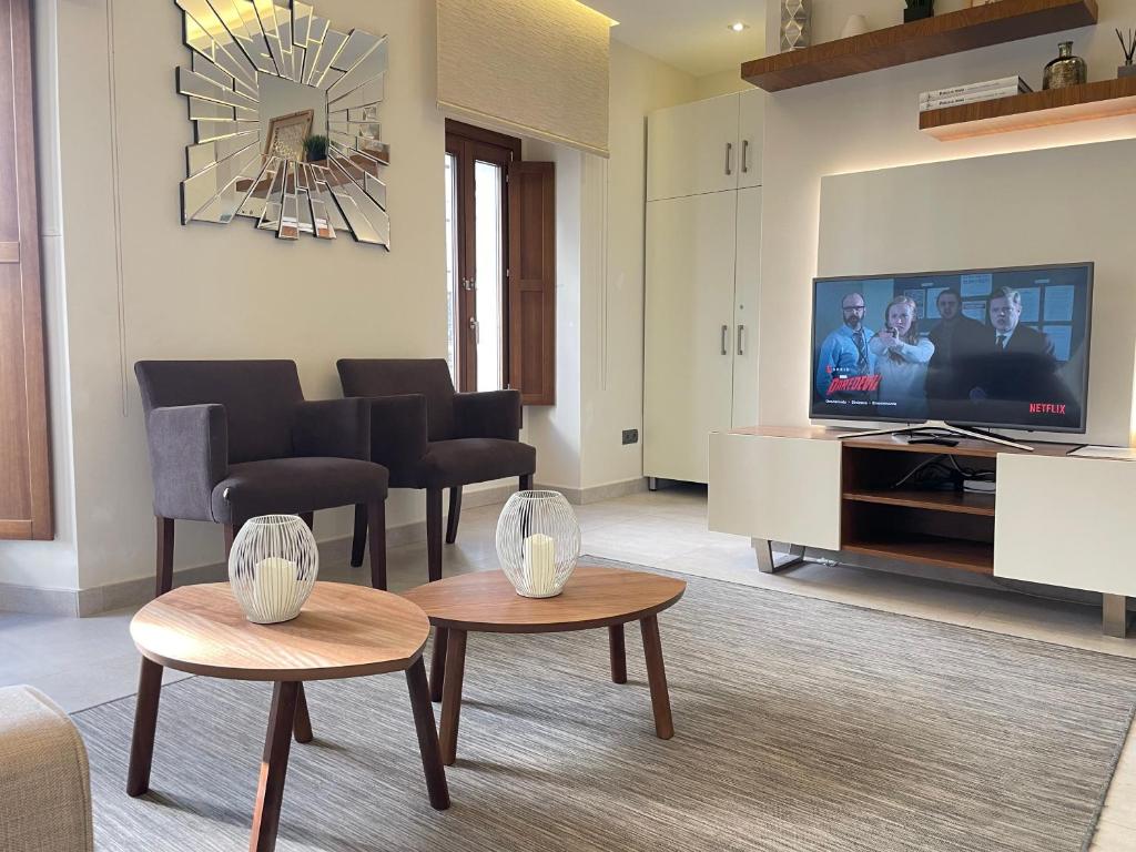 A television and/or entertainment centre at Gav Espinel Ronda Centro