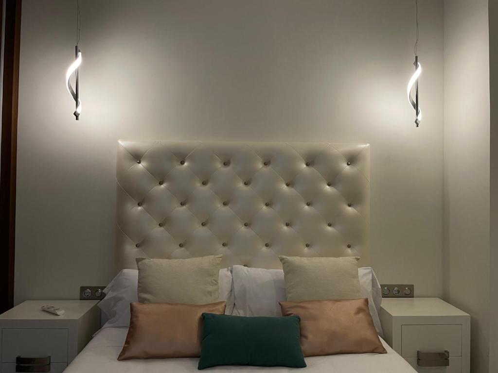 A bed or beds in a room at Gav Espinel Ronda Centro