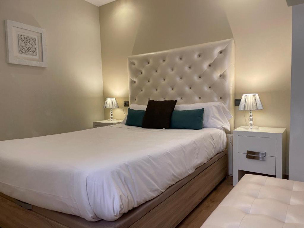 A bed or beds in a room at Gav Espinel Ronda Centro