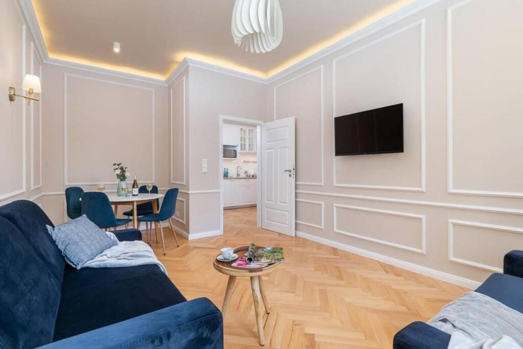 Televízia a/alebo spoločenská miestnosť v ubytovaní Apartamenty - MI HAPPY II
