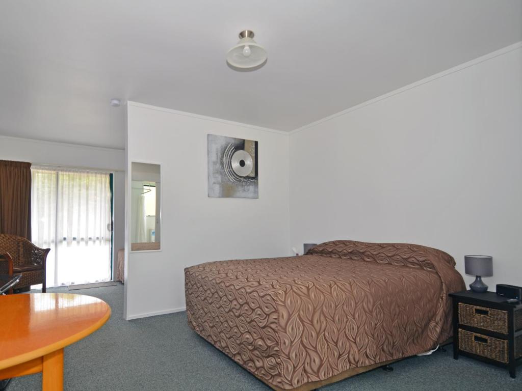 Postel nebo postele na pokoji v ubytování Celtic Motel