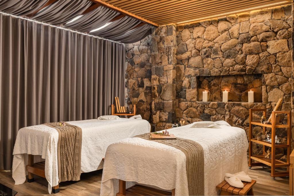 Postel nebo postele na pokoji v ubytování Hotel Valle Dincanto