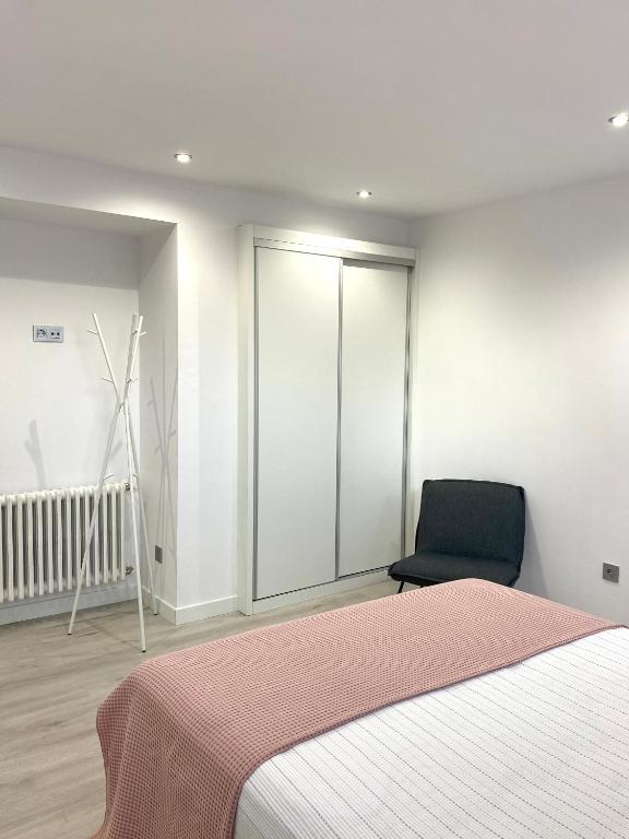 Postel nebo postele na pokoji v ubytování Apartamentos el Oligo