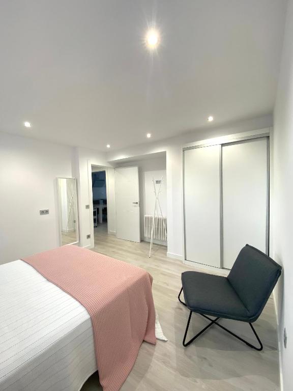 Postel nebo postele na pokoji v ubytování Apartamentos el Oligo