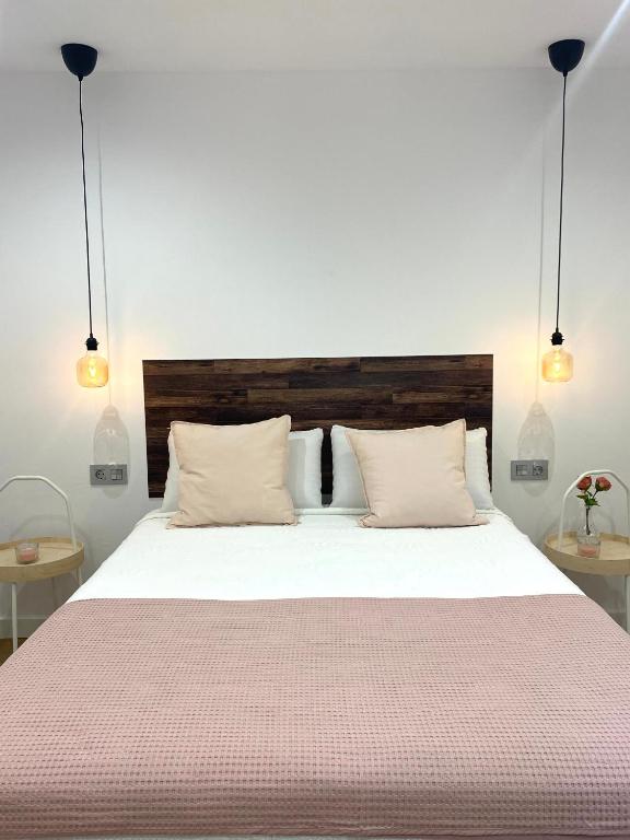 Postel nebo postele na pokoji v ubytování Apartamentos el Oligo