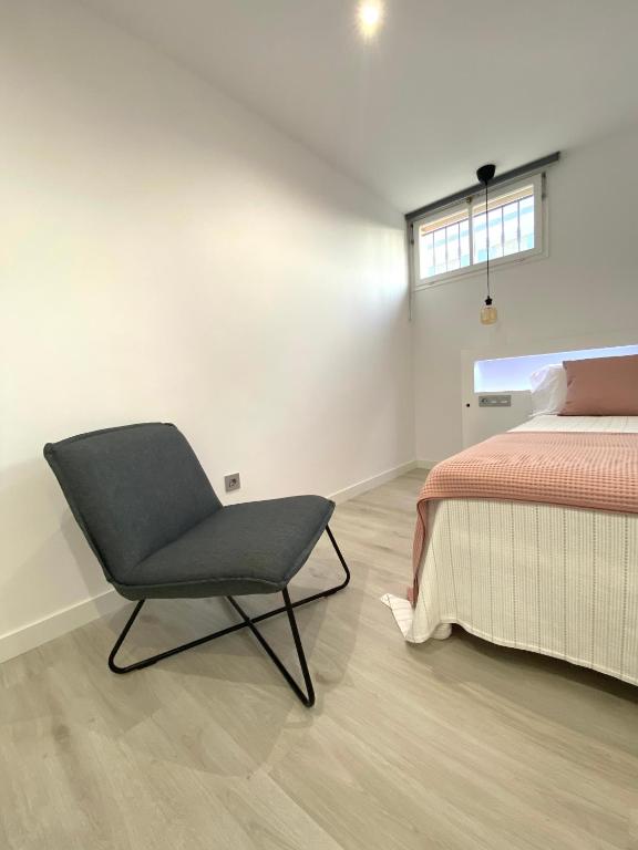 Postel nebo postele na pokoji v ubytování Apartamentos el Oligo
