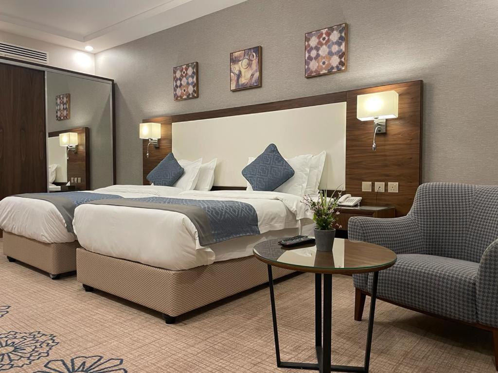 Postelja oz. postelje v sobi nastanitve فندق ارض العسل بوتيك