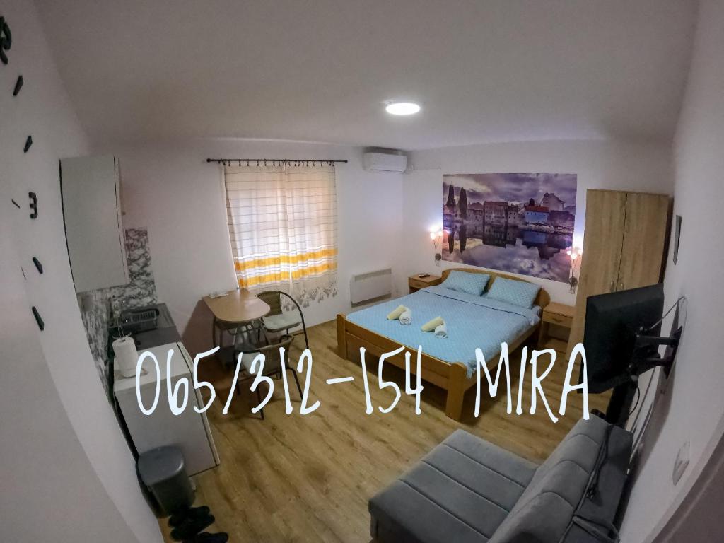 a small room with a bed and a couch at Sobe Mira in Trebinje