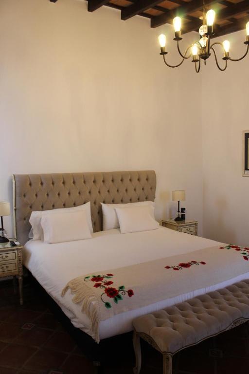 Кровать или кровати в номере Iraola Hotel Boutique