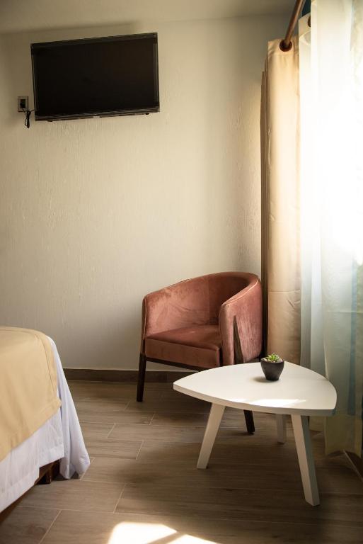 TV a/nebo společenská místnost v ubytování Hotel Casa Jima Agave