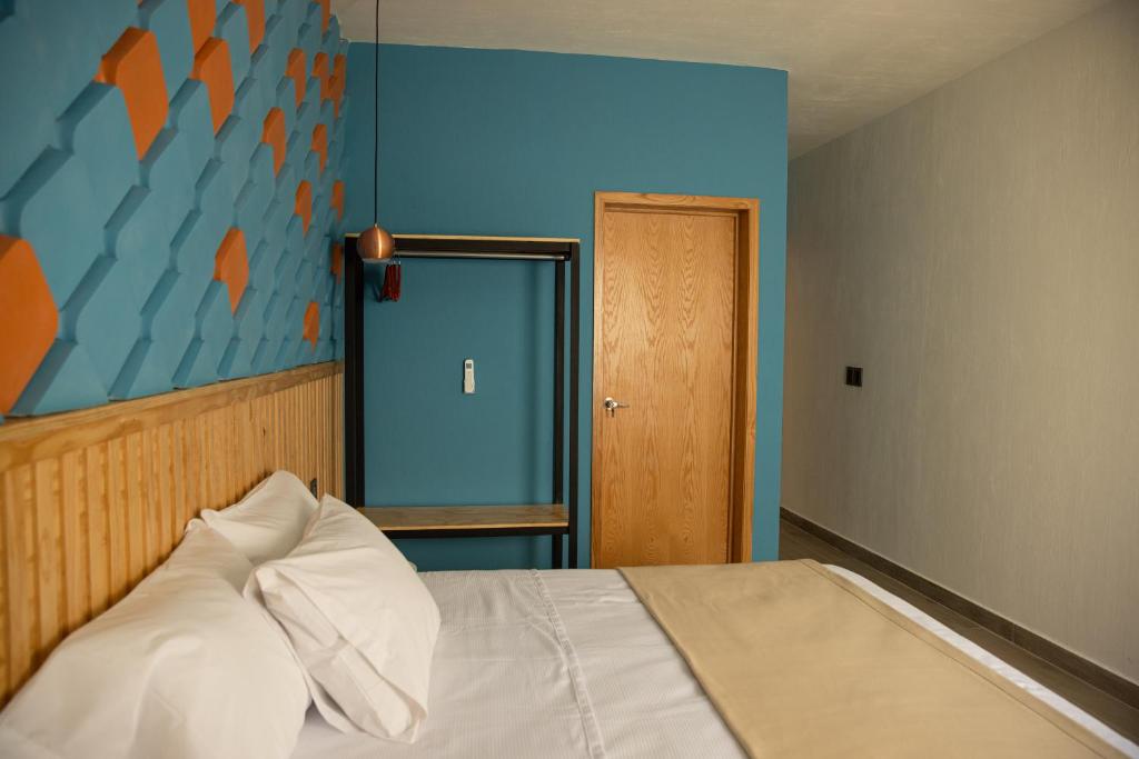 Postel nebo postele na pokoji v ubytování Hotel Casa Jima Agave
