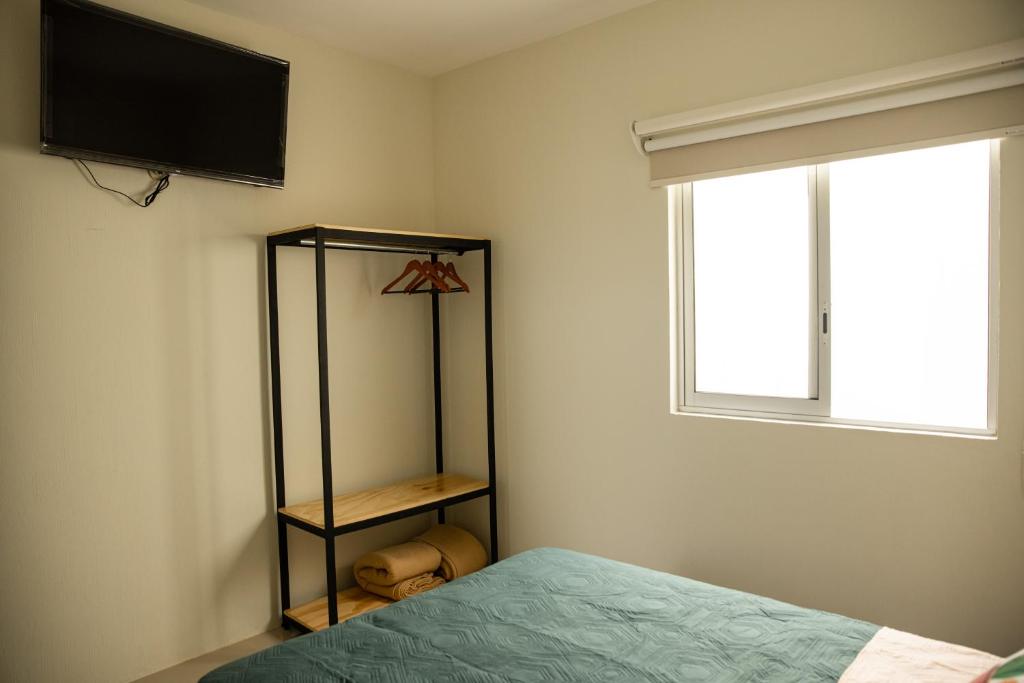 Postel nebo postele na pokoji v ubytování Hotel Casa Jima Agave