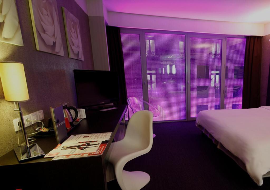 Postel nebo postele na pokoji v ubytování Le Rex Hôtel