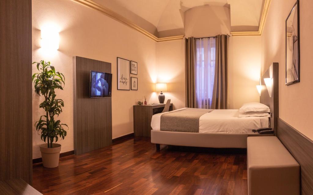 Postel nebo postele na pokoji v ubytování Hotel Boutique Antiche Mura