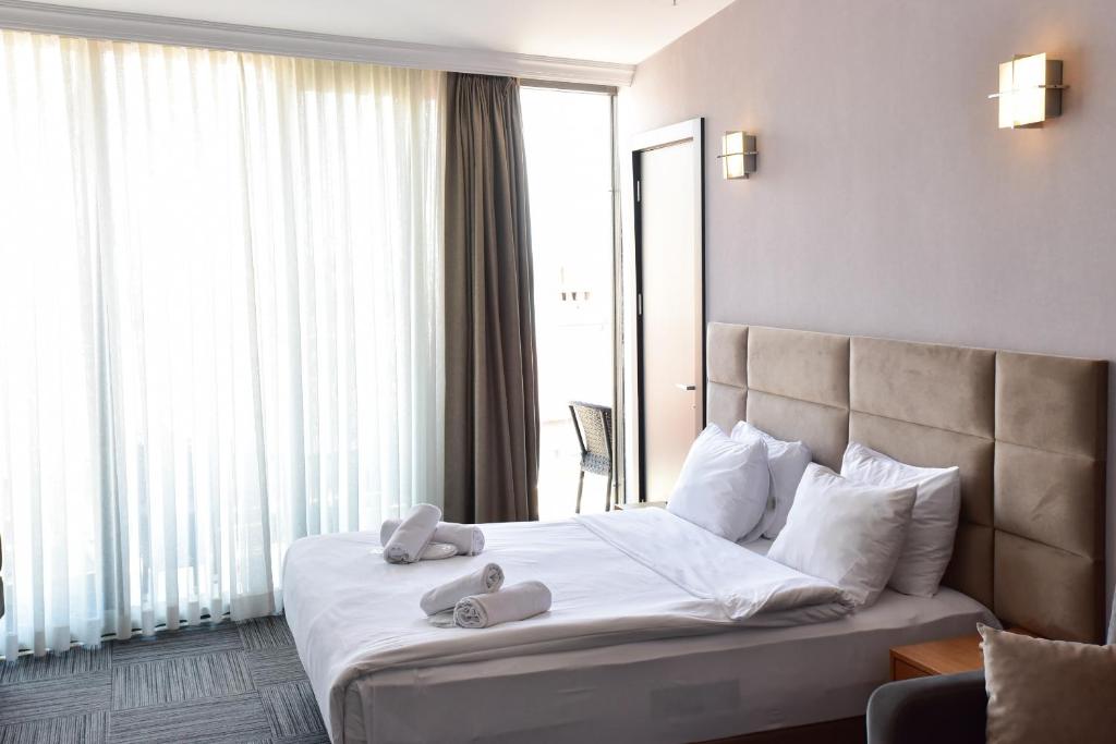 A bed or beds in a room at Taksim Hotel V Plus