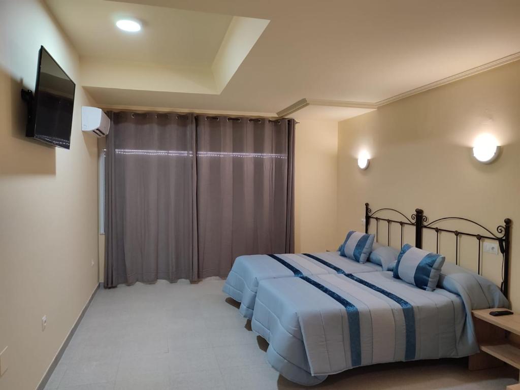 Posteľ alebo postele v izbe v ubytovaní Hotel Novo