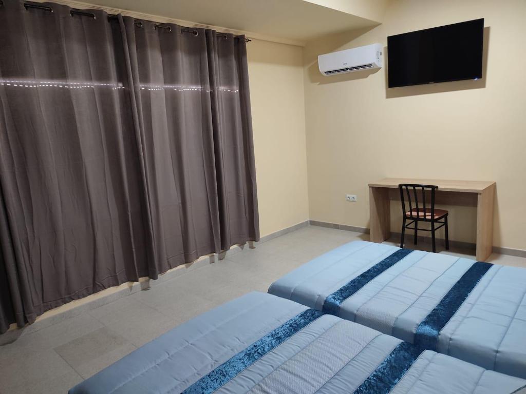 Posteľ alebo postele v izbe v ubytovaní Hotel Novo