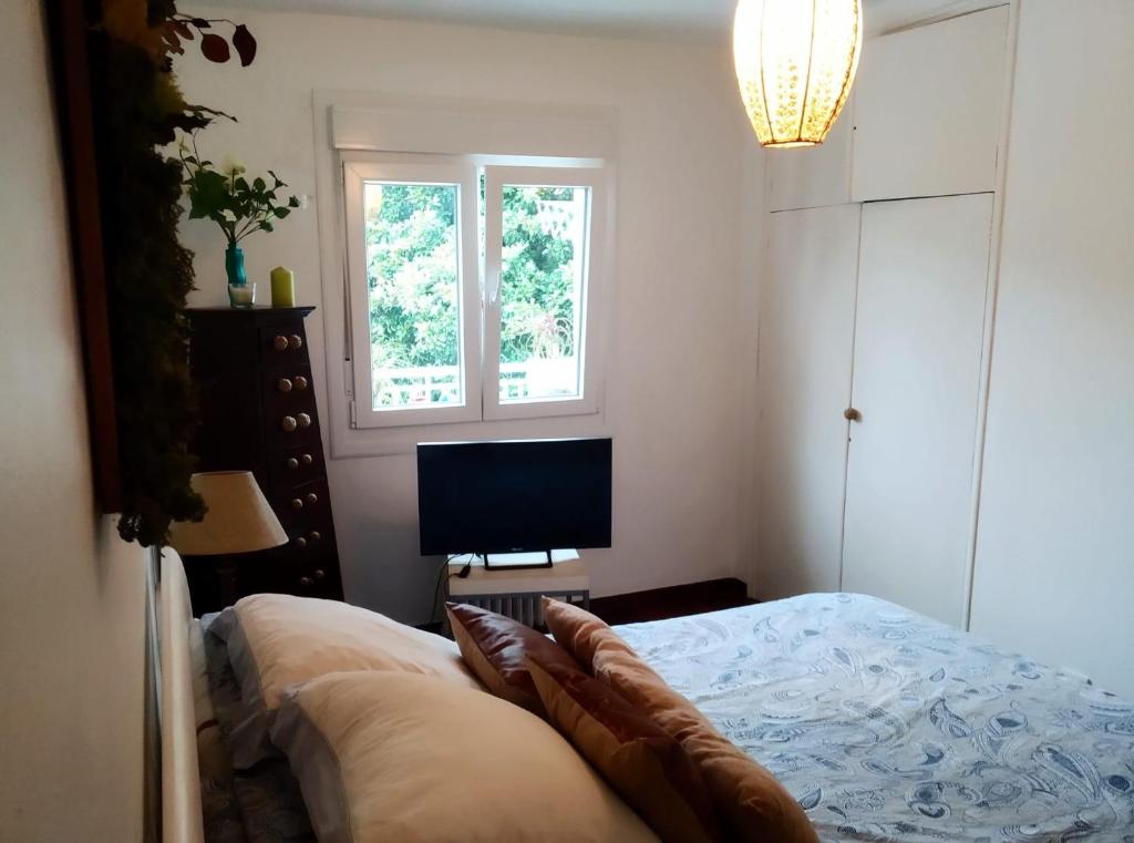 Postel nebo postele na pokoji v ubytování Villa tana, casa compartida