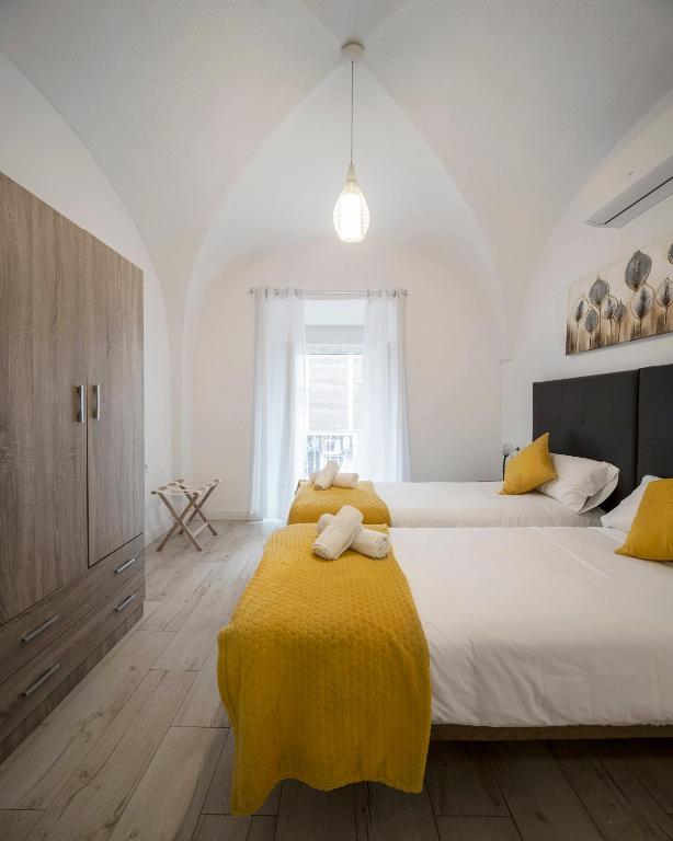 Postel nebo postele na pokoji v ubytování Apartamentos Gladiador