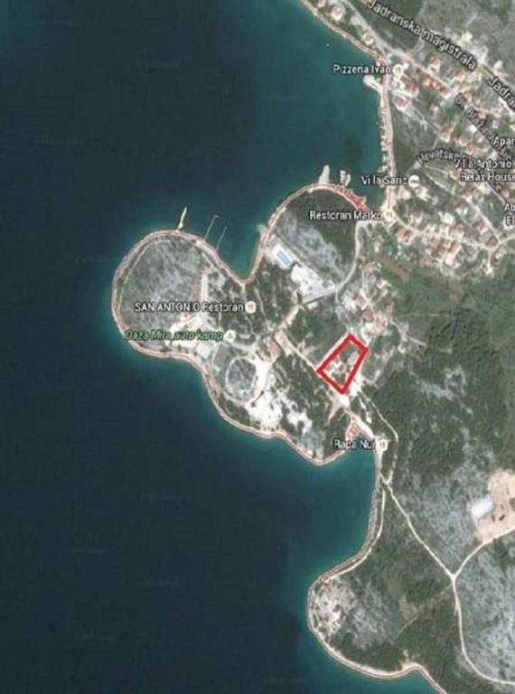 a map with a red building in the water at Mobile Home Sea Shell Šime, Drage in Drage