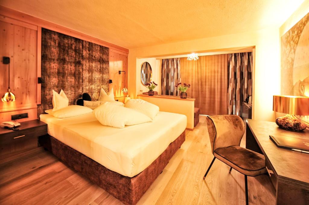Postel nebo postele na pokoji v ubytování Die Seefelderin - Boutiquehotel St. Georg