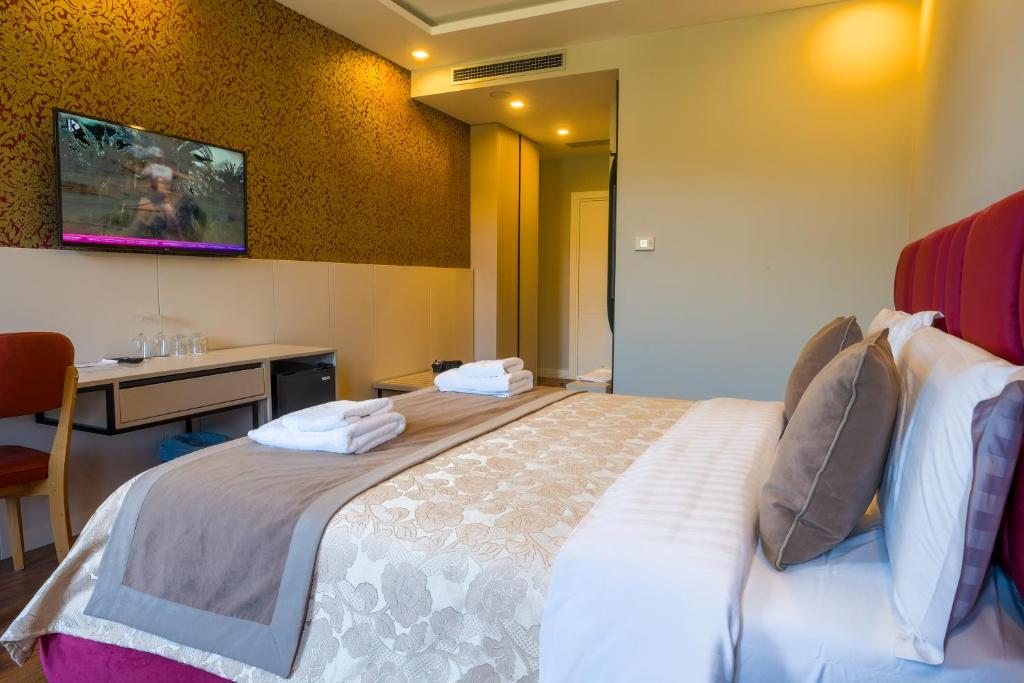 Postel nebo postele na pokoji v ubytování Royal East Resort