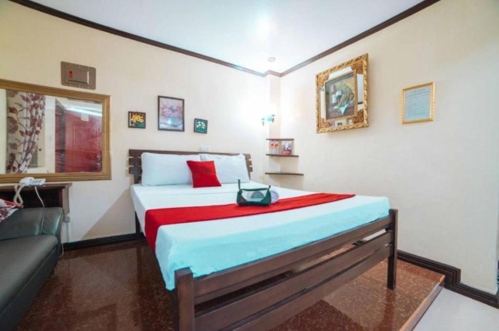 Postel nebo postele na pokoji v ubytování RedDoorz at Tagaytay Road