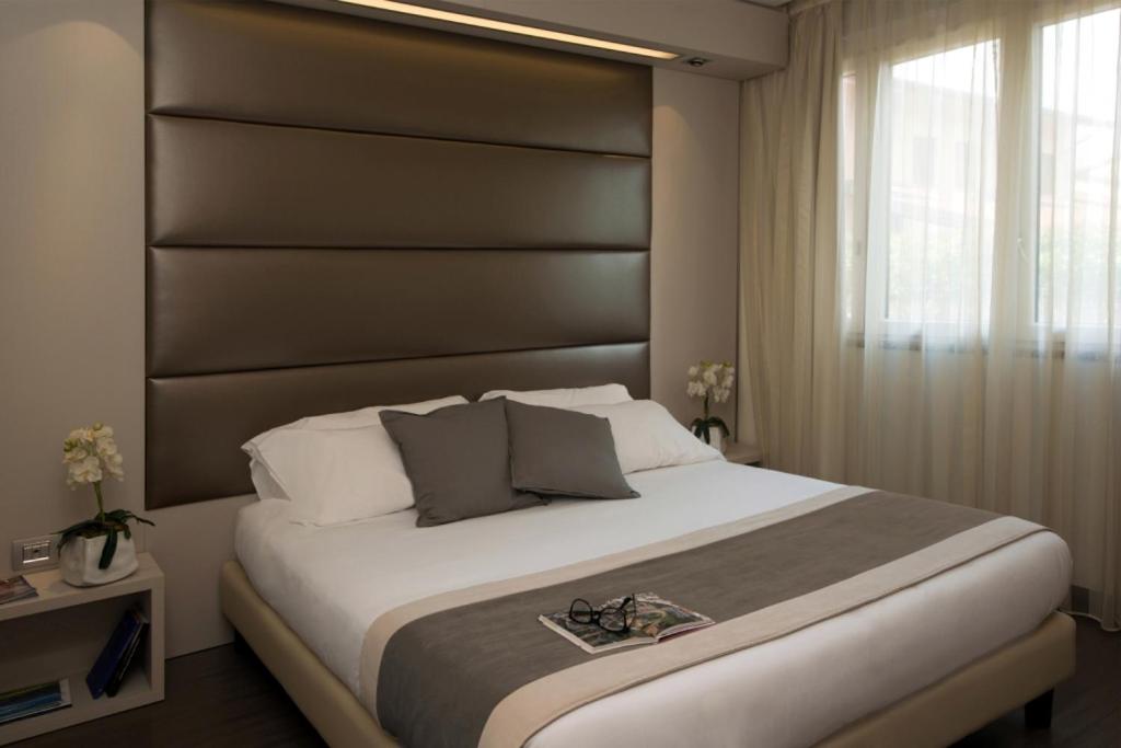 Postel nebo postele na pokoji v ubytování As Hotel Dei Giovi