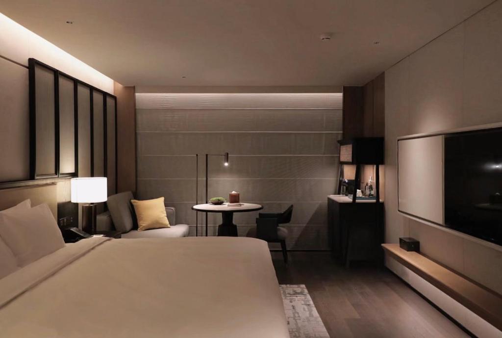 Postel nebo postele na pokoji v ubytování Prime Hotel Beijing Wangfujing
