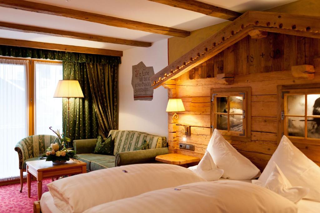 Postel nebo postele na pokoji v ubytování Hotel Solaria Ischgl - 4 superior