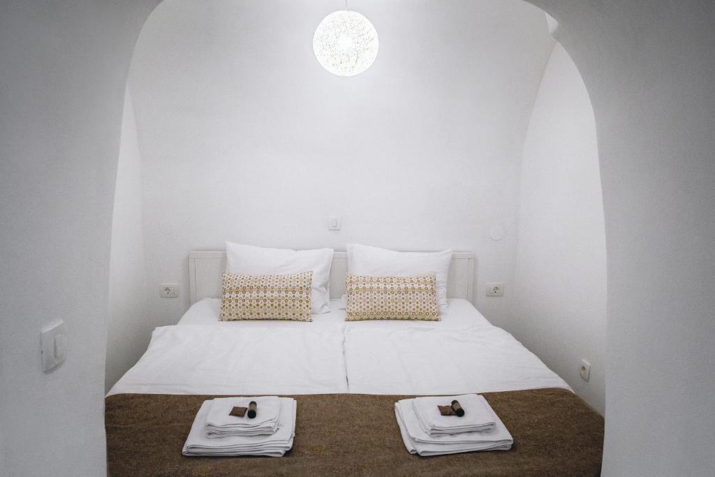 Postel nebo postele na pokoji v ubytování Apartments Hiša Pod Gradom