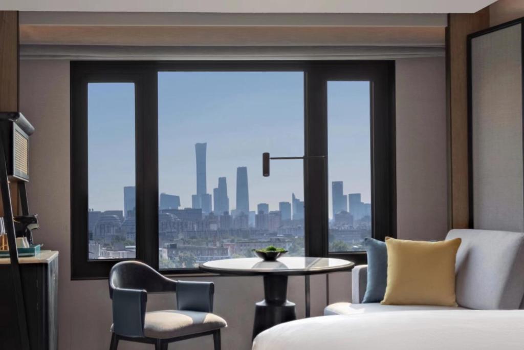 Postel nebo postele na pokoji v ubytování Prime Hotel Beijing Wangfujing