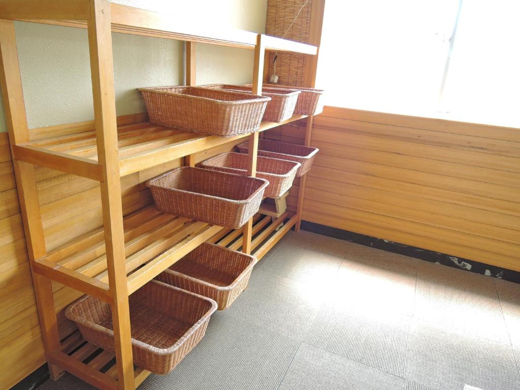 Palanda nebo palandy na pokoji v ubytování Maruni Ryokan