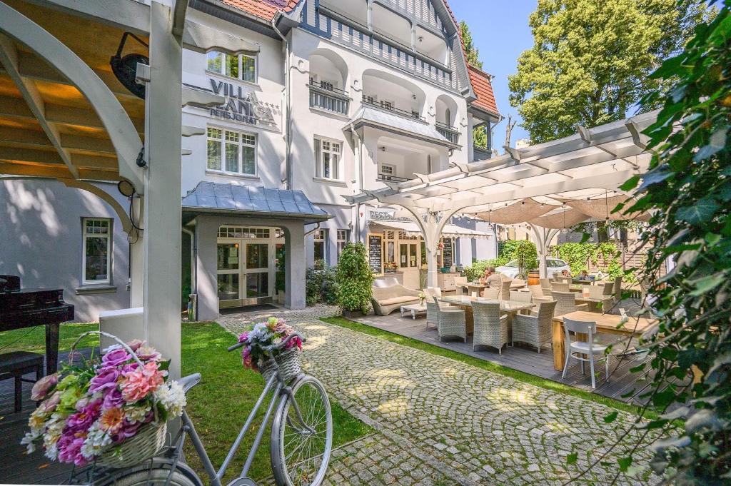 a bike parked in front of a building at Villa Polanica in Polanica-Zdrój