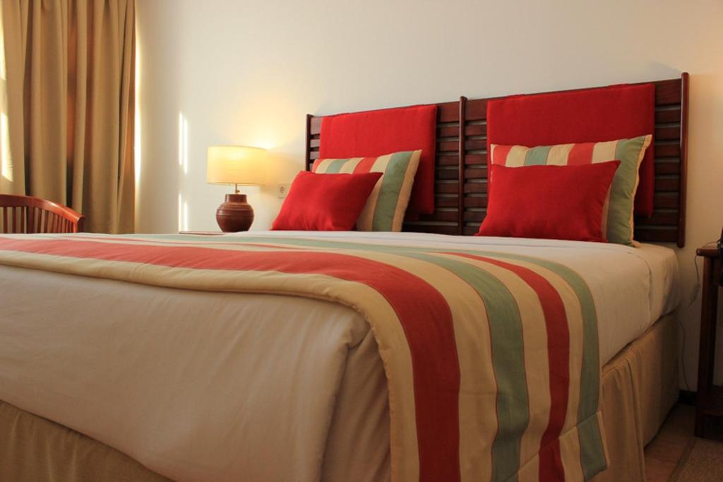 Postel nebo postele na pokoji v ubytování Hotel Timor