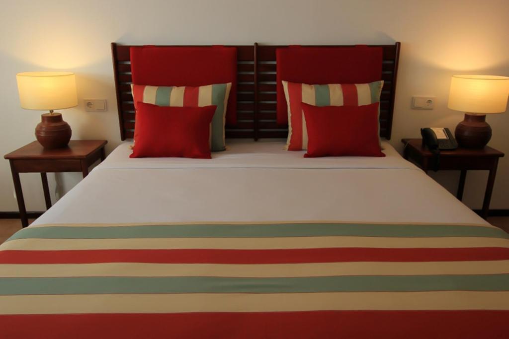 Postel nebo postele na pokoji v ubytování Hotel Timor