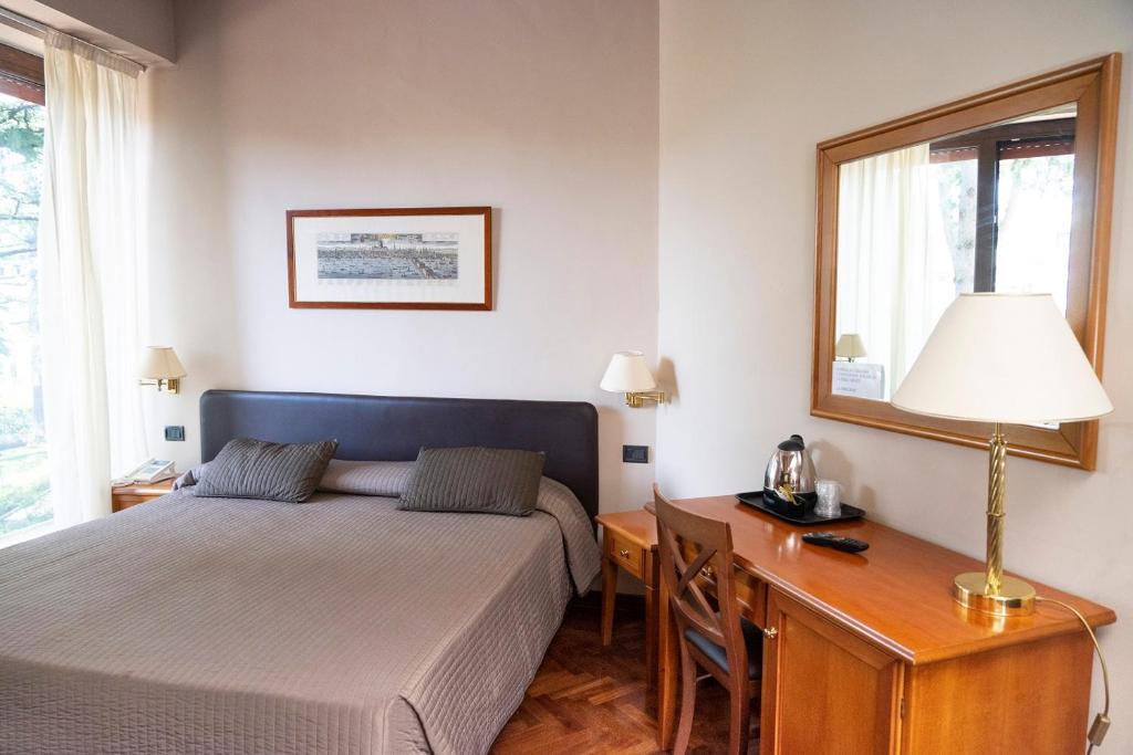 Postel nebo postele na pokoji v ubytování Hotel San Giorgio