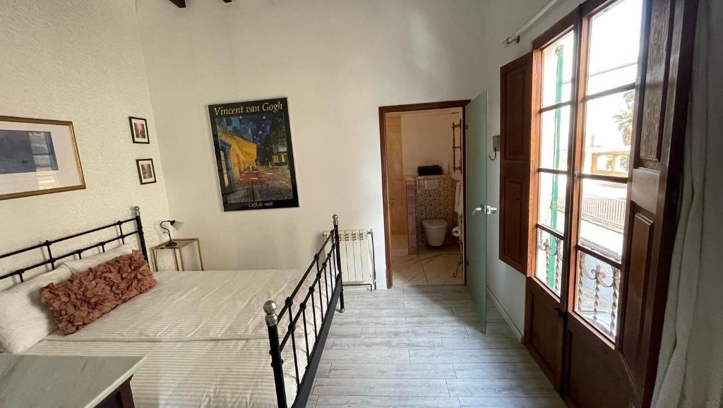 Postel nebo postele na pokoji v ubytování CasaDesigual